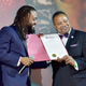 Actor Machel Montano and New York State Senator Jesse Hamilton speak onstage during Bazodee premiere and concert featuring Machel Montano and friends at PlayStation Theater on July 27, 2016 in New York City.